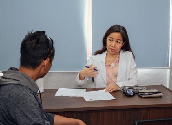 Dr. Jennifer Alejandro conducts a drug dependency examination